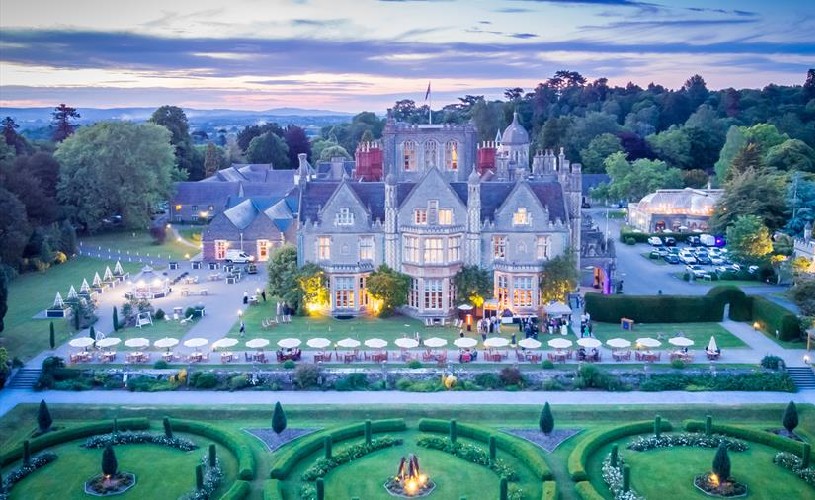 Aerial view of De Vere Tortworth Court and grounds with outdoor seating and car park